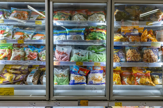 Valmier, Latvia - November 24, 2025: Frozen food display in supermarket showcasing a variety of packaged meals and vegetables, highlighting convenience and modern shopping experience