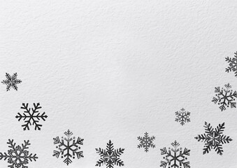 Snow flakes patter on white paper
