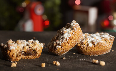 Christmas mince pies with Christmas decorations in the background
