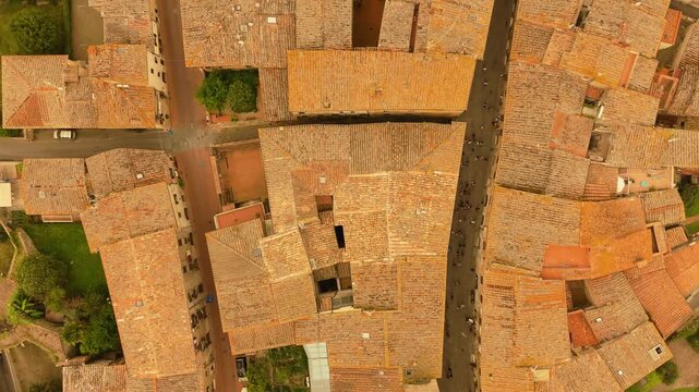 Bird's-eye view flight over medieval Tuscan town of San Gimignano