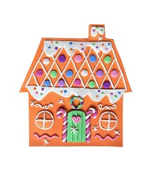 Cute gingerbread houses with icing details and candy decorations create a festive Christmas village scene perfect for holiday cards, winter backgrounds, and seasonal design