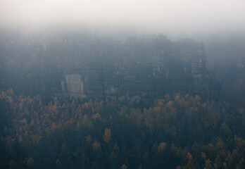 view from the kleiner winterberg saxony switzerland with a lot of fog moody mood foggy cloudy