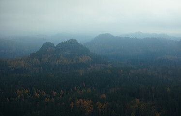 view from the kleiner winterberg saxony switzerland with a lot of fog moody mood foggy cloudy