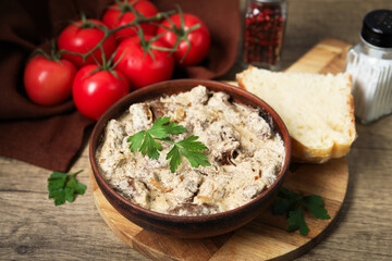 Tasty beef Stroganoff served on wooden table, closeup