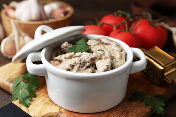 Tasty beef stroganoff with parsley served on wooden table, closeup