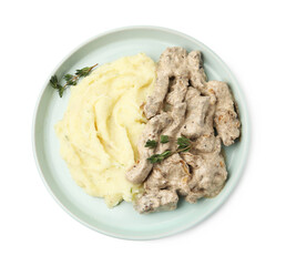 Delicious beef stroganoff with mashed potatoes and thyme isolated on white, top view