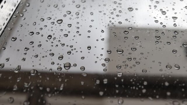 Timelapse of Raindrops on the Window with Clouds in the Background