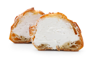 Halves of tasty profiterole with whipped cream isolated on white