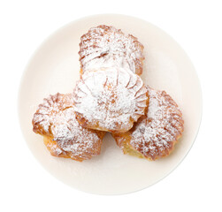 Tasty profiteroles with powdered sugar isolated on white, top view
