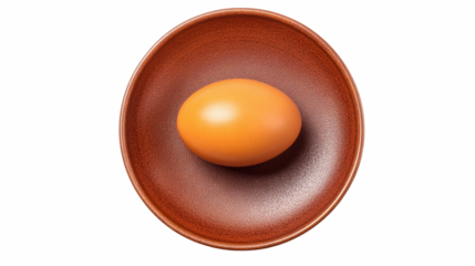 Orange dyed hard boiled egg on a brown plate top view, clip art sticker