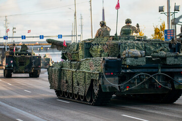 NATO main battle tanks moving in coordinated formation showcasing alliance armored strength,...