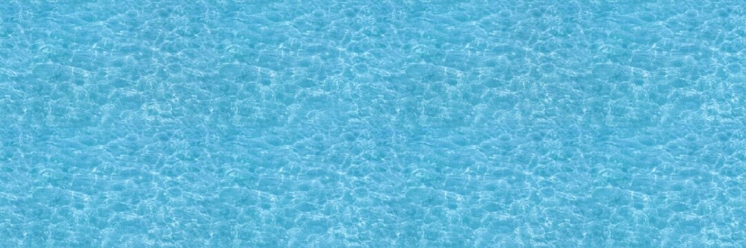 Water ripple seamless background texture - top view of clean, clear, blue water ripples. Image can be tiled to create a larger image or higher resolution background. Water has the chemical formula H2O