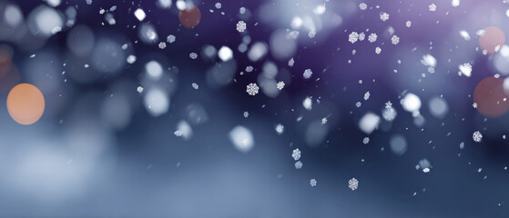 Close-up of delicate snowflakes falling against a blurred blue and purple winter background with soft bokeh lights
