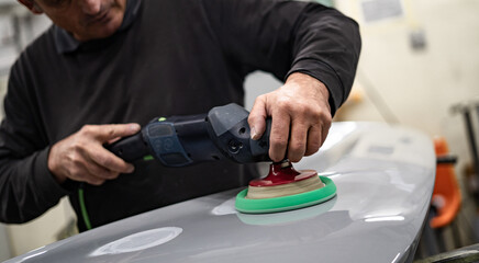 Industrial workshop with the metal frame construction of a bus or RV. Large vehicle chassis in fabrication, showcasing manufacturing, engineering, and assembly environment.