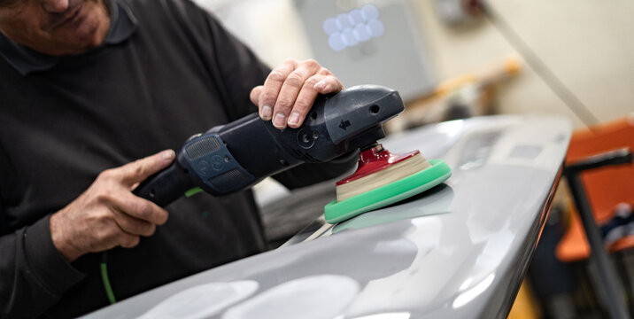 Industrial workshop with the metal frame construction of a bus or RV. Large vehicle chassis in fabrication, showcasing manufacturing, engineering, and assembly environment.