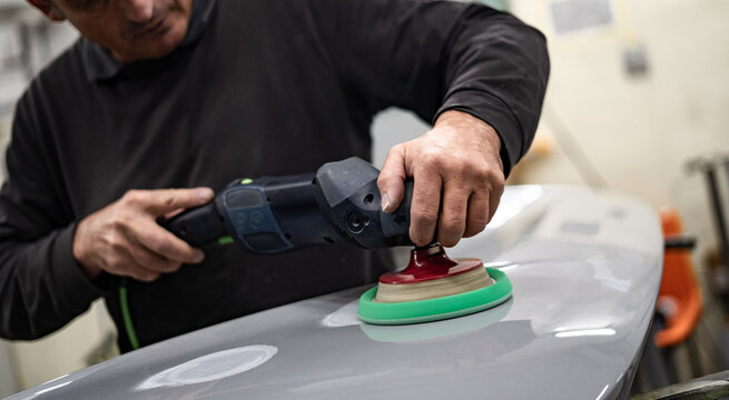 Industrial workshop with the metal frame construction of a bus or RV. Large vehicle chassis in fabrication, showcasing manufacturing, engineering, and assembly environment.