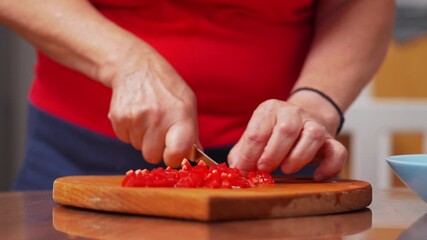 Cutting fresh tomatoes in a cozy kitchen with natural light for a healthy meal preparation - Powered by Adobe