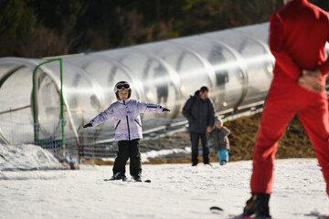 Ski coach giving a lesson to a child