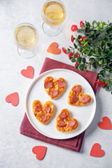 Pizza mini with salami in the form of hearts for Valentine's day holiday on a white background