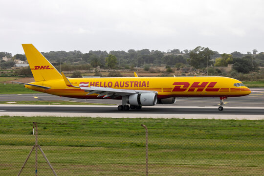 Luqa, Malta - November 26, 2025: DHL Air Austria Boeing 757-223(PCF) (REG: OE-LNZ) with special SERVUS and HELLO Austria titles, just landed and on thrust reversers to slow down.