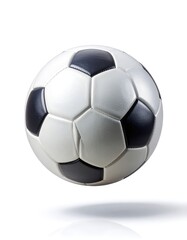 Fototapeta premium A classic black and white soccer ball floating above a reflective white surface