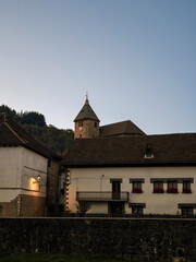 Otsagabia village church tower and traditional houses at dusk © larrui