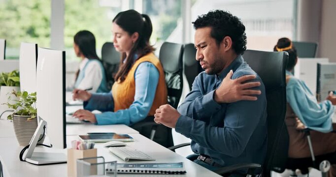 Businessman, shoulder pain and computer with injury for overworked strain or discomfort in office. Frustrated man, team or sore arm for joint inflammation, muscle tension or pressure in workplace