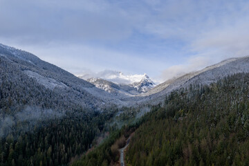 Snowy Mountain Valley in BC Canada: Peaceful Winter Landscape With Forest and Mist