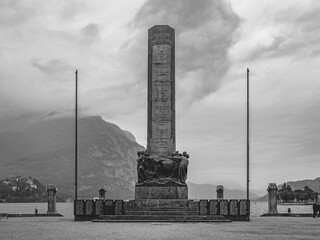 The Monument to the Fallen in Lecco, 1926 work by G. Castiglioni. An imposing granite stele with an allegory of the Homeland, located on the promenade with views of the Alps and Lake Como.