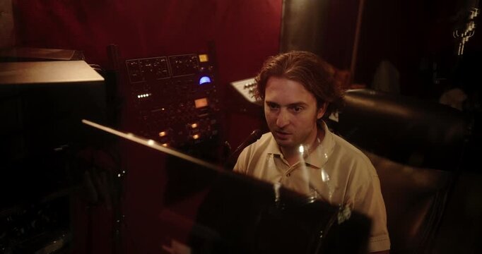 Sound engineer working on audio mixing console