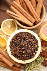 Different spices, dry orange slices and honey for mulled wine on table, flat lay