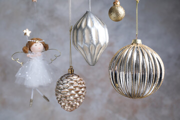Obraz premium Beautiful Christmas decor hanging near light grey wall, closeup