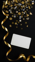 Blank white card gold ribbon sparkling confetti on a black background for festive celebration design concept