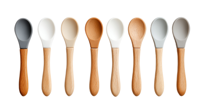 Wooden and ceramic spoons aligned in neutral and earthy tones, isolated