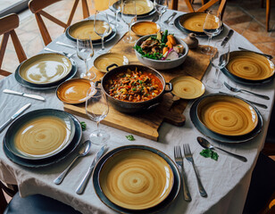 Rustic dining table set with homemade stew for family meal
