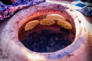 Making tandoori bread at home.