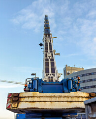 back of a liebherr mobile crane against a partly cloudy sky