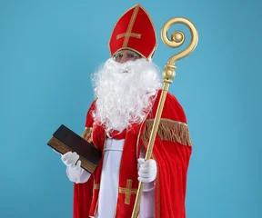 Fotobehang Muziek Saint Nicholas with book and crozier on blue background  © New Africa