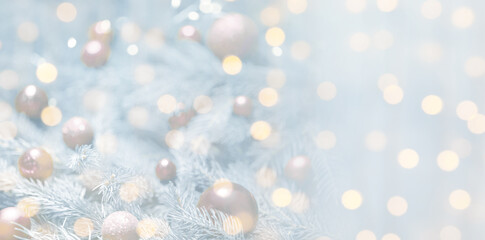 Christmas greeting card with fir tree branches and bokeh lights. Banner design