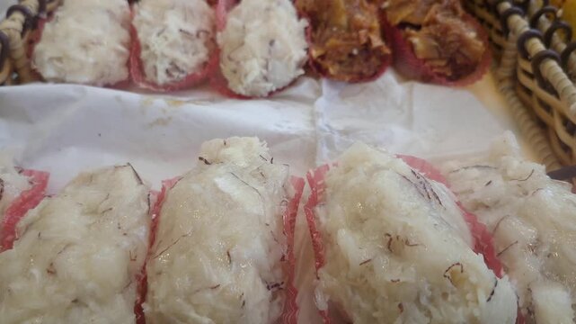 Cocadas on a wooden tray, traditional Brazilian sweet made with coconut.