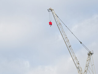 Tower cranes high in sky at construction site