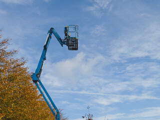 Access platform equipment powered high in sky at construction building site
