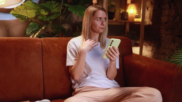 Portrait of woman browse products in internet online shopping store planning trip travel or swiping through profiles on dating app on smartphone at home Choice concept