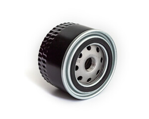 Black car oil filter for engine maintenance isolated on a clean white background with shadow.