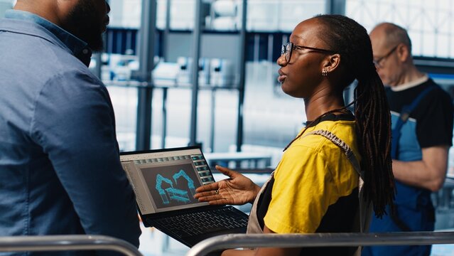 Engineers meeting with smart factory investor, showing insights based on collected data. Specialists discussing with industrial plant shareholder, presenting metrics gathered by sensors, camera A - Powered by Adobe