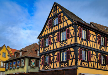 Festive decorations on half timbered houses, Colmar Christmas Market in France