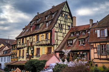 Festive decorations on half timbered houses, Colmar Christmas Market in France