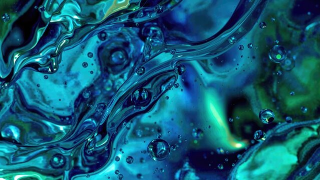 Abstract blue and green liquid swirl with bubbles, creating a dynamic and fluid movement.