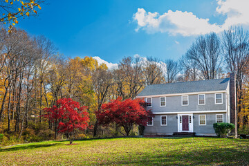 Fall colors highlight a typical Connecticut house surrounded by nature