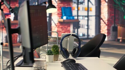 Empty AI developer desk including a monitor filled with neural network data, highlighting cloud computing, network connectivity and pattern recognition in scientific research. Notes tree.